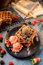 Waffles with ice cream, caramel sauce and fresh berries. Delicious Waffle with berry and ice cream at cafe. Royalty Free Stock Photo