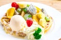 The Waffles, ice cream and fruit in dish on table. Royalty Free Stock Photo