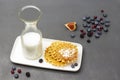 Waffles and milk in bottle on white plate. Figs and berries on the table Royalty Free Stock Photo