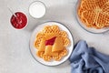 Waffles with Norwegian brunost traditional brown cheese and raspberry jam Royalty Free Stock Photo