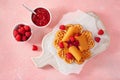 Waffles with Norwegian brunost traditional brown cheese and raspberry jam Royalty Free Stock Photo