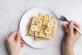 waffles plate with banana slices hand holding fork. High quality photo Royalty Free Stock Photo