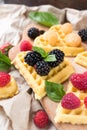 Belgian waffles with fresh raspberries and honey syrup