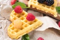 Belgian waffles with fresh raspberries and honey syrup