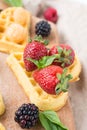 Belgian waffles with fresh raspberries and honey syrup