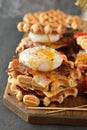 Waffles sandwich with poached egg Royalty Free Stock Photo