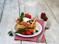 Waffles with strawberries, blueberry and milk Royalty Free Stock Photo