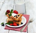 Waffles with strawberries, blueberry and milk Royalty Free Stock Photo