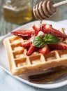 Waffles with strawberry and honey