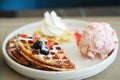 Waffles and Strawberry Ice-cream, Caramel syrup and fresh berry. Royalty Free Stock Photo