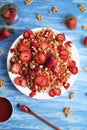 Waffles with strawberry on white plate on blue background. Top view flat lay Royalty Free Stock Photo