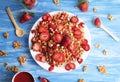 Waffles with strawberry on white plate on blue background. Top view flat lay Royalty Free Stock Photo