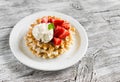 Waffles with vanilla ice cream and strawberries on a white plate Royalty Free Stock Photo