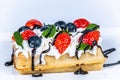 Waffles with whipped cream and fresh fruit. Royalty Free Stock Photo