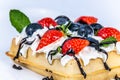 Waffles with whipped cream and fresh fruit. Royalty Free Stock Photo