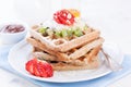 Waffles with wholewheat flour and fruits on a white plate Royalty Free Stock Photo