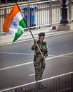 Wagah border, Punjab, India - April 14th, 2019 : A lady officer of Indian Border Security Force, waving Indian National Flag