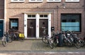 Wageningen, Gelderland, The Netherlands - Brick stone residential facades of student homes with bikes in front