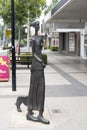 Mary and Muuj is a popular bronze sculpture representing a girl walking her dog. Royalty Free Stock Photo