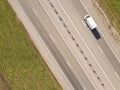 Wagon driving on the highway, aerial. Transport logistics background top view. Royalty Free Stock Photo