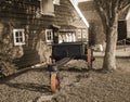 Wagon under a tree in sepia landscape Royalty Free Stock Photo