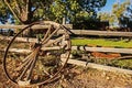 Wagon Wheel against wooden fence Royalty Free Stock Photo