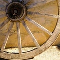 Detail of a wagon wheel against a wall