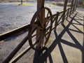 Wagon Wheel On Rustic Wooden Fence Royalty Free Stock Photo
