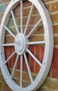 Wagon wheel on wall Royalty Free Stock Photo