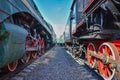 Between wagons of old trains, between two old trains, red metal train wheels Royalty Free Stock Photo