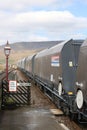 Wagons on stone train passing through Ribblehead