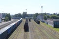 Summer railway station with rails and freight cars. View from above. Royalty Free Stock Photo