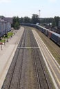 Summer railway station with rails and freight cars. View from above. Royalty Free Stock Photo