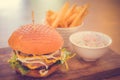 Wagyu Burger , Bacon, cheddar, truffle mayo, bois bourdon sauce, pickles, yellow mustard, caramalised onions mesclun in a brioche Royalty Free Stock Photo