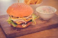 Wagyu Burger , Bacon, cheddar, truffle mayo, bois bourdon sauce, pickles, yellow mustard, caramalised onions mesclun in a brioche