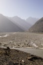 Wahkan valley in Tajikistan. Above the river is Afghanistan with the Hindu Kush