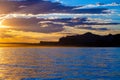 Wahweap Bay Silohuette at Sunset with Rays of Light Streaming Through Clouds Royalty Free Stock Photo