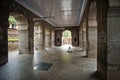 Hall of ancient Hindu Vishnu Temple with decorated arches in stone