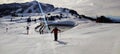 Waidring, Austria - 15.01.2023 : View of skiers on the slopes, downhill skiing on an almost empty slope, sunny day Royalty Free Stock Photo