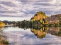 Waikato river reflections in the morning with moody sky Royalty Free Stock Photo