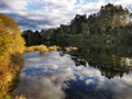 Waikato river reflections in the summer evening light in New Zealand Royalty Free Stock Photo