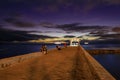 Waikiki Beach walls pier at a golden hour sunset Royalty Free Stock Photo