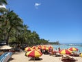 People play in the protected water and hang out on the beach in Royalty Free Stock Photo