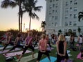 Large group of People do yoga at Vino and Vinyasa event