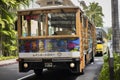 Waikiki Trolley in the streets of Oahu. The front of it shows Heather Brown`s art.