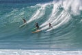 Waimea Bay HI, Surfers riding a wave Royalty Free Stock Photo