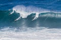 Waimea bay Oahu Hawaii, Surfers ride a big wave Royalty Free Stock Photo