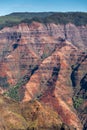 Closeup of Red rock flank with green of Waimea Canyon, Kauai, Hawaii, USA Royalty Free Stock Photo