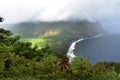 Waimea Valley Hawaii Overlook Foggy view of Coast. Heavy cloud cover of fertile utopian paradise valley from top of mountain with Royalty Free Stock Photo