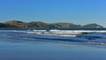 Wainui Beach with great view of nearby mountain ridges in Gisborne, New Zealand